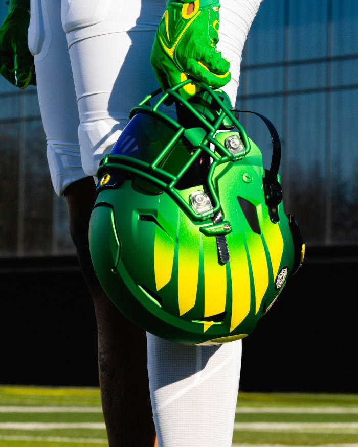 Oregon Ducks defensive lineman Brandon Dorlus models a uniform for the Pac-12 Championship against Washington.